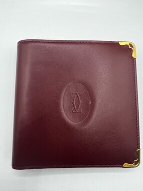 Cartier vintage Must de Cartier bifold wallet, crafted from burgundy calfskin